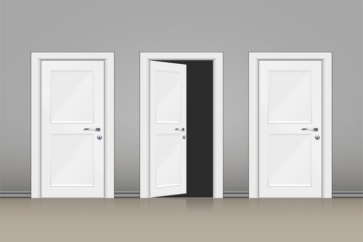 Grey wall with three doors in center